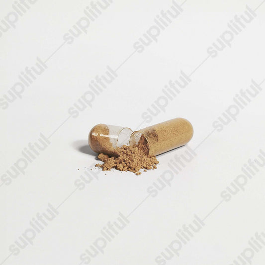 Open capsule of superfood blend powder spilling onto a surface, highlighting its antioxidant and wellness benefits.